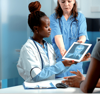 Doctor explaining x ray scan on tablet to sick patient in medical cabinet  Medic showing radiography diagnosis on digital device for healthcare examination to woman with disease 